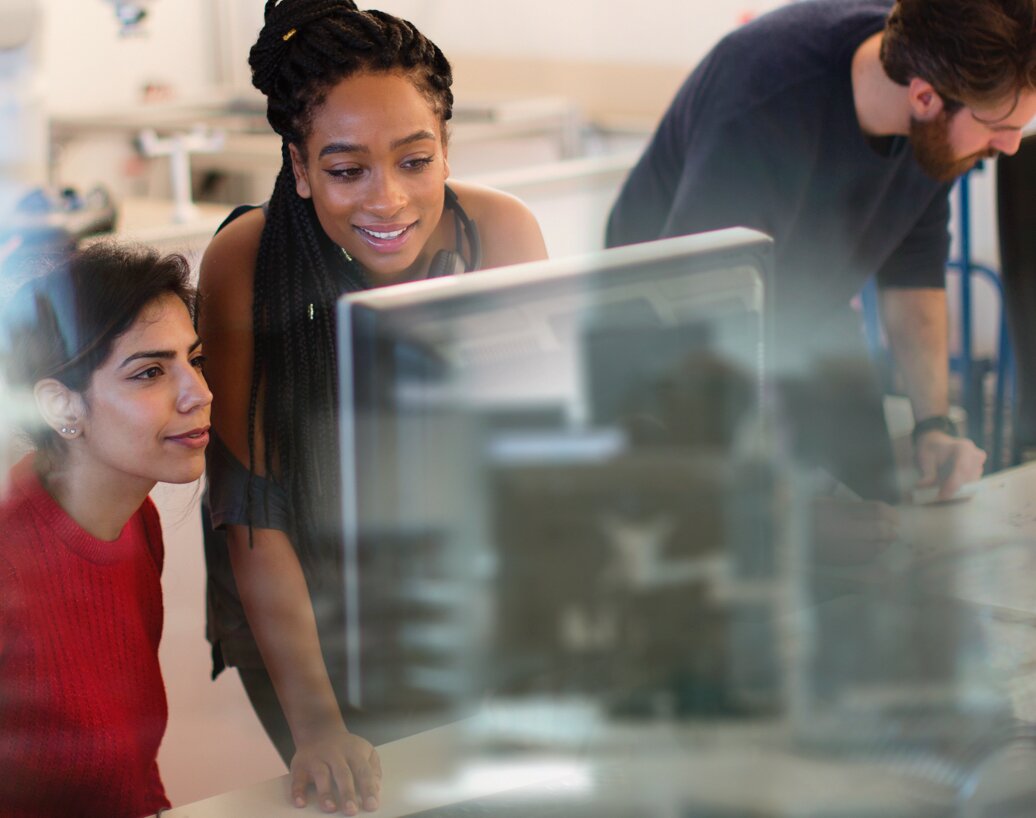 Two women looking at a computer screen